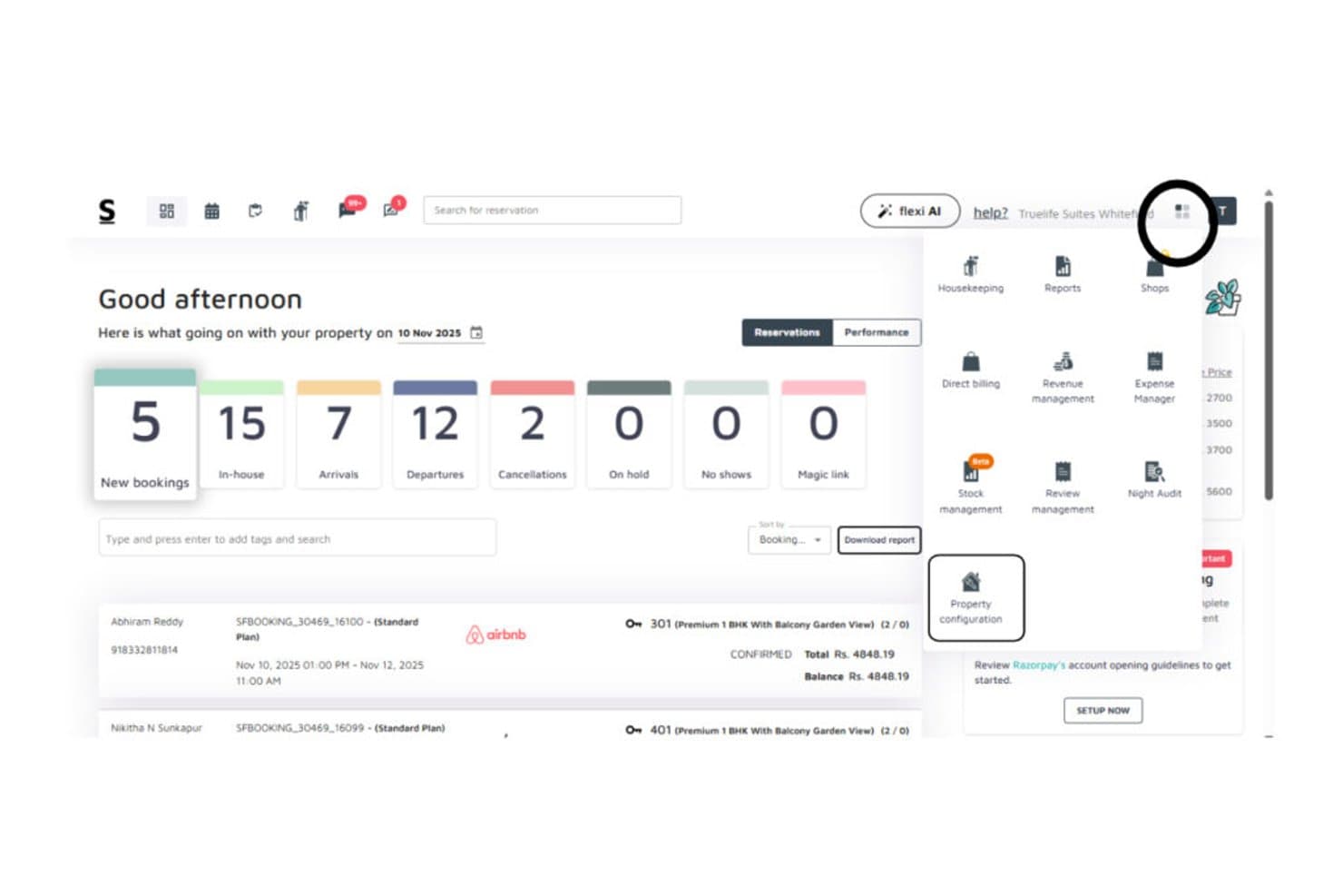 Stayflexi dashboard showing bookings, arrivals, and property configuration menu open.