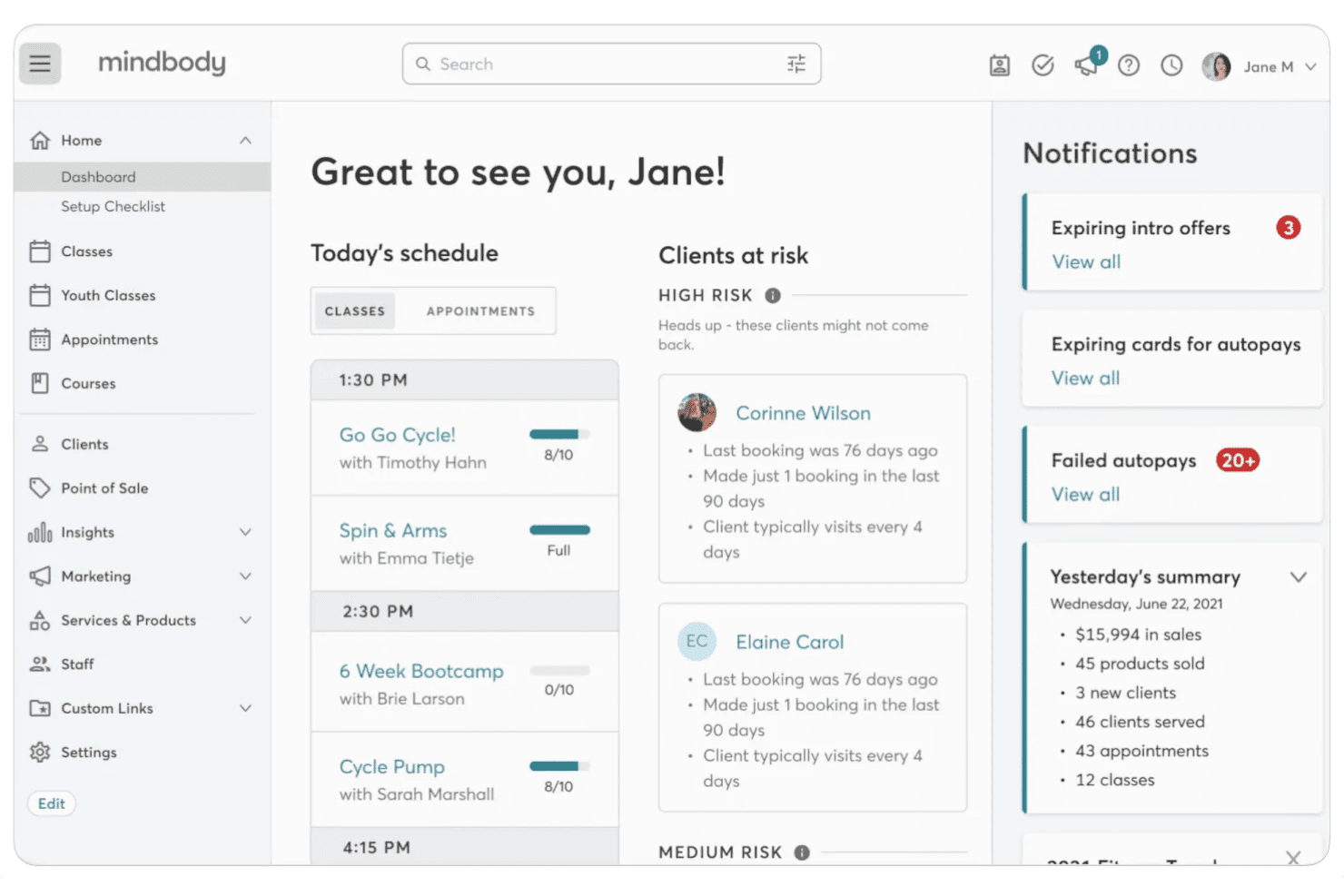 Mindbody dashboard showing today's class schedule, at-risk clients, and notifications panel.