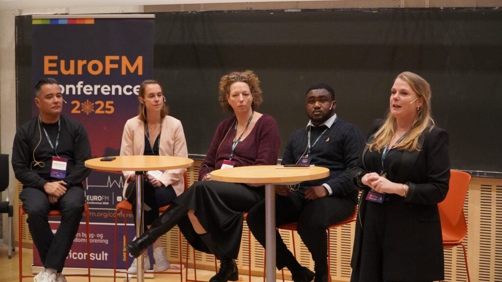 Speakers participating in a panel discussion during the EuroFM Conference