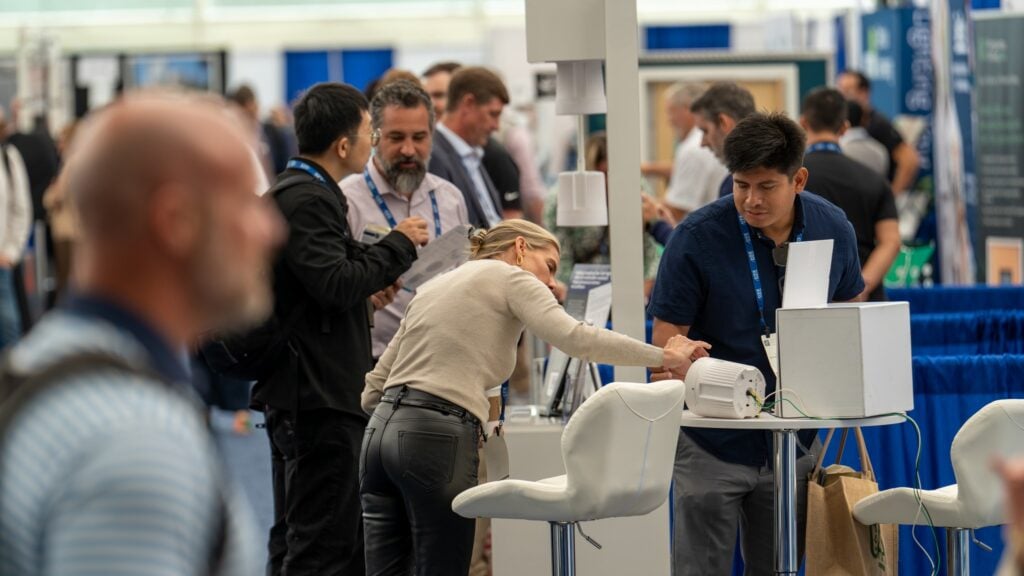 Conference attendees inspects a product demonstrations at the Healthcare Facilities Symposium &amp; Expo
