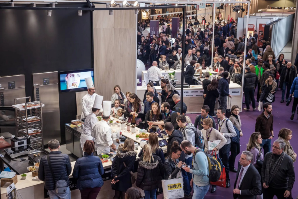 Chefs presenting live cooking sessions at Sirha Lyon exhibition floor